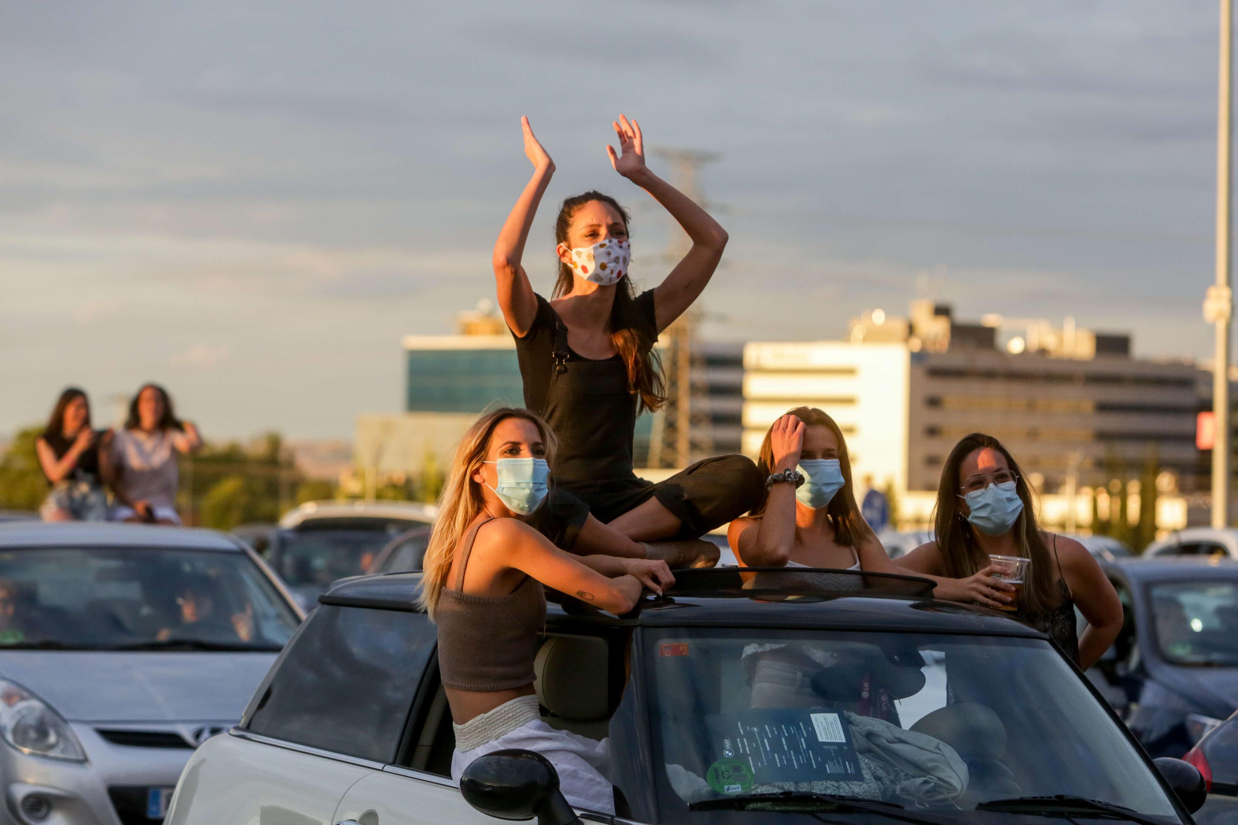 A group of people attending the BMW Drive-In Fest in Spain.