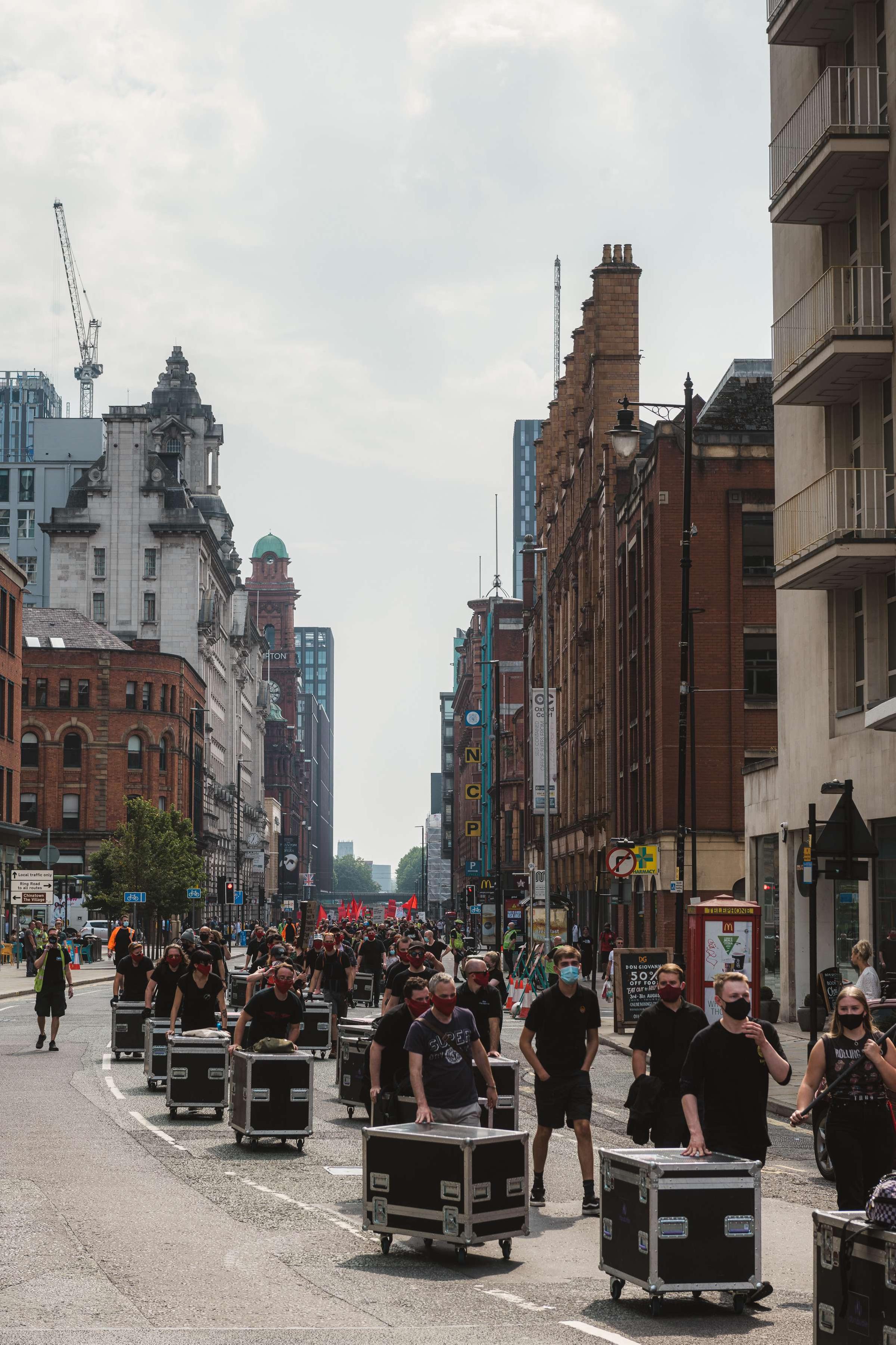 150 flight cases were pushed 1.2 miles through Manchester, England.