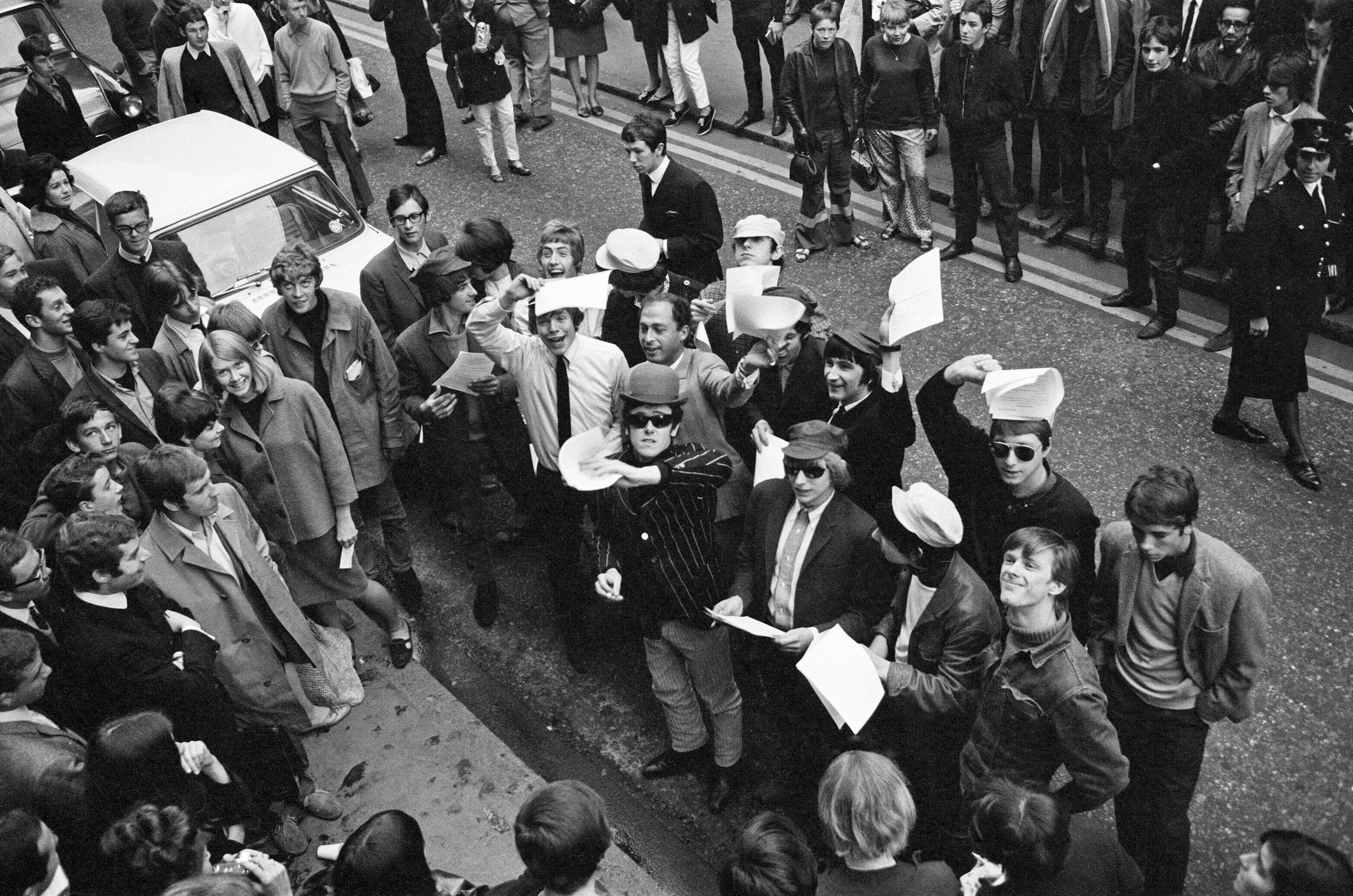 Pop stars meet in Carnaby Street, London to become founder members of an anti bowler hat group to be known as the bowler hat brigade.