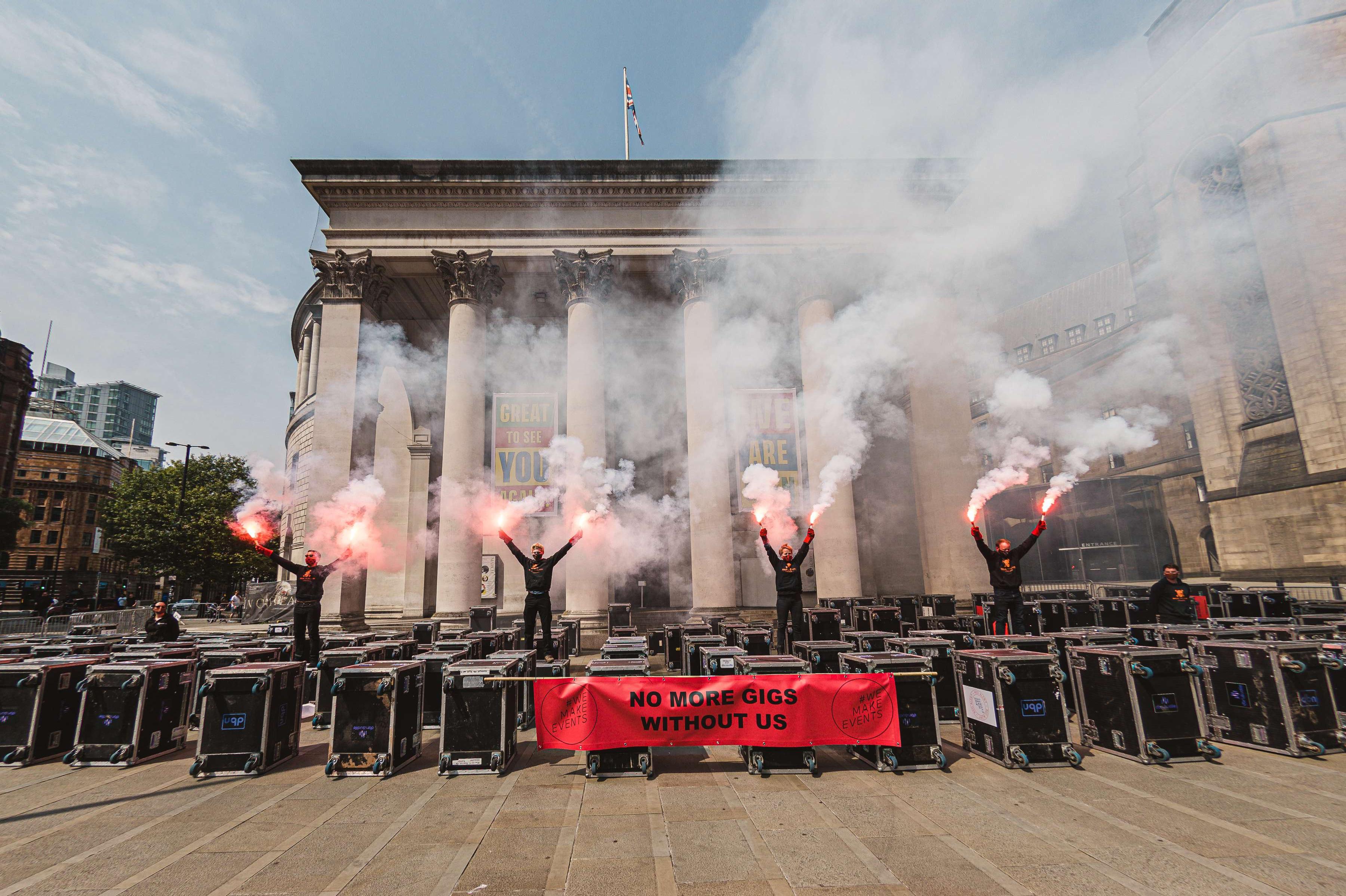 The silent march ended with a red flare display.