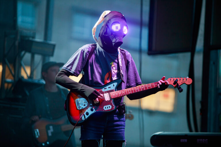 Will Toledo of Car Seat Headrest wears a mask while