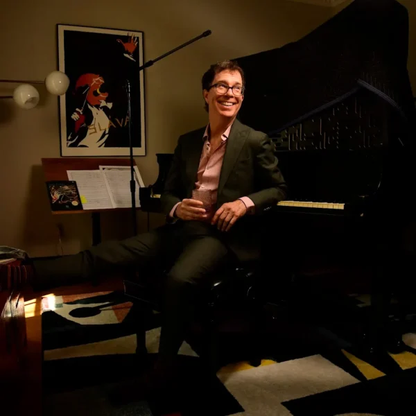 Ben at the piano smiling
