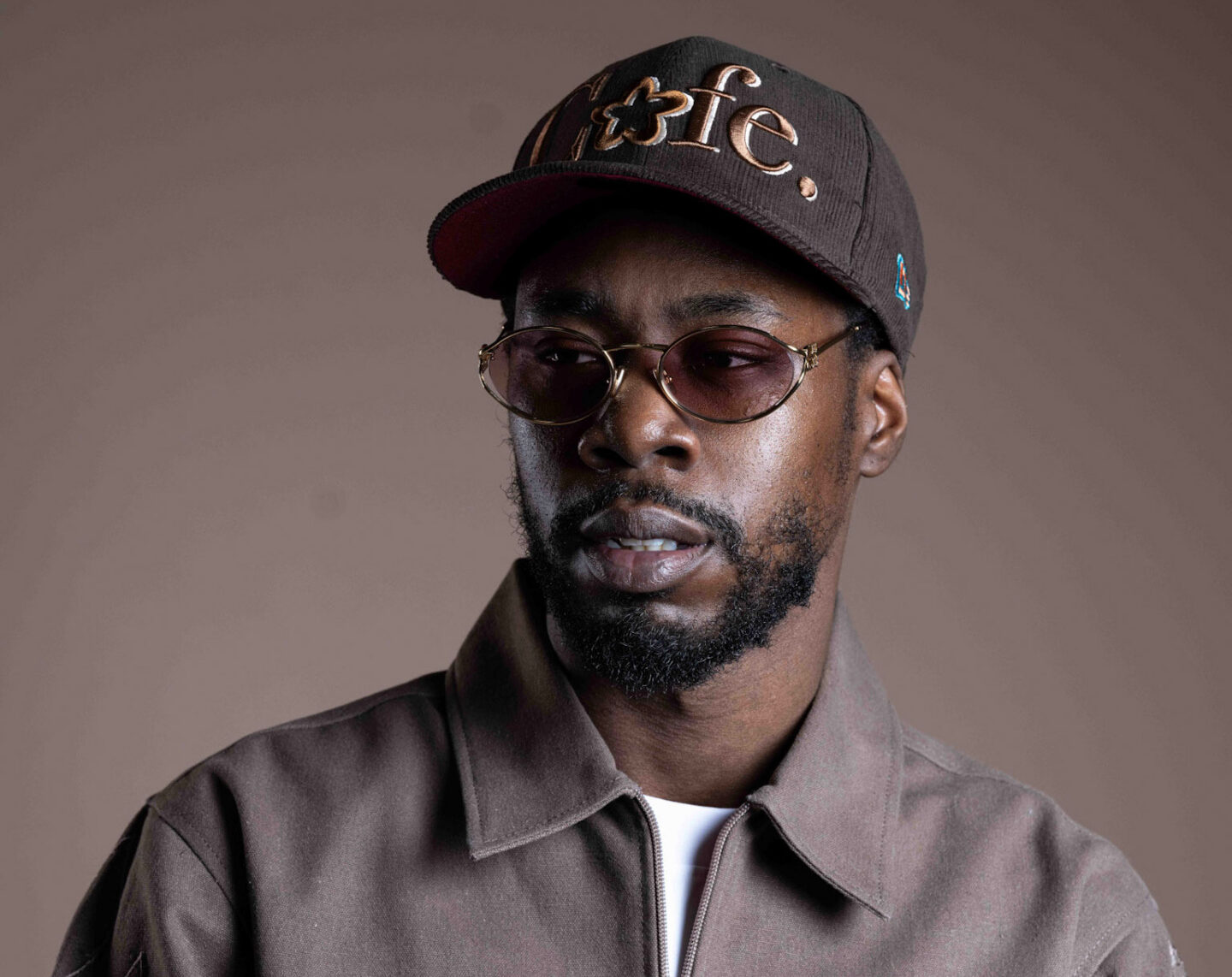 A portrait of Billie Essco taken in Buffalo, NY wearing his clothing brand, CAFE. 2026