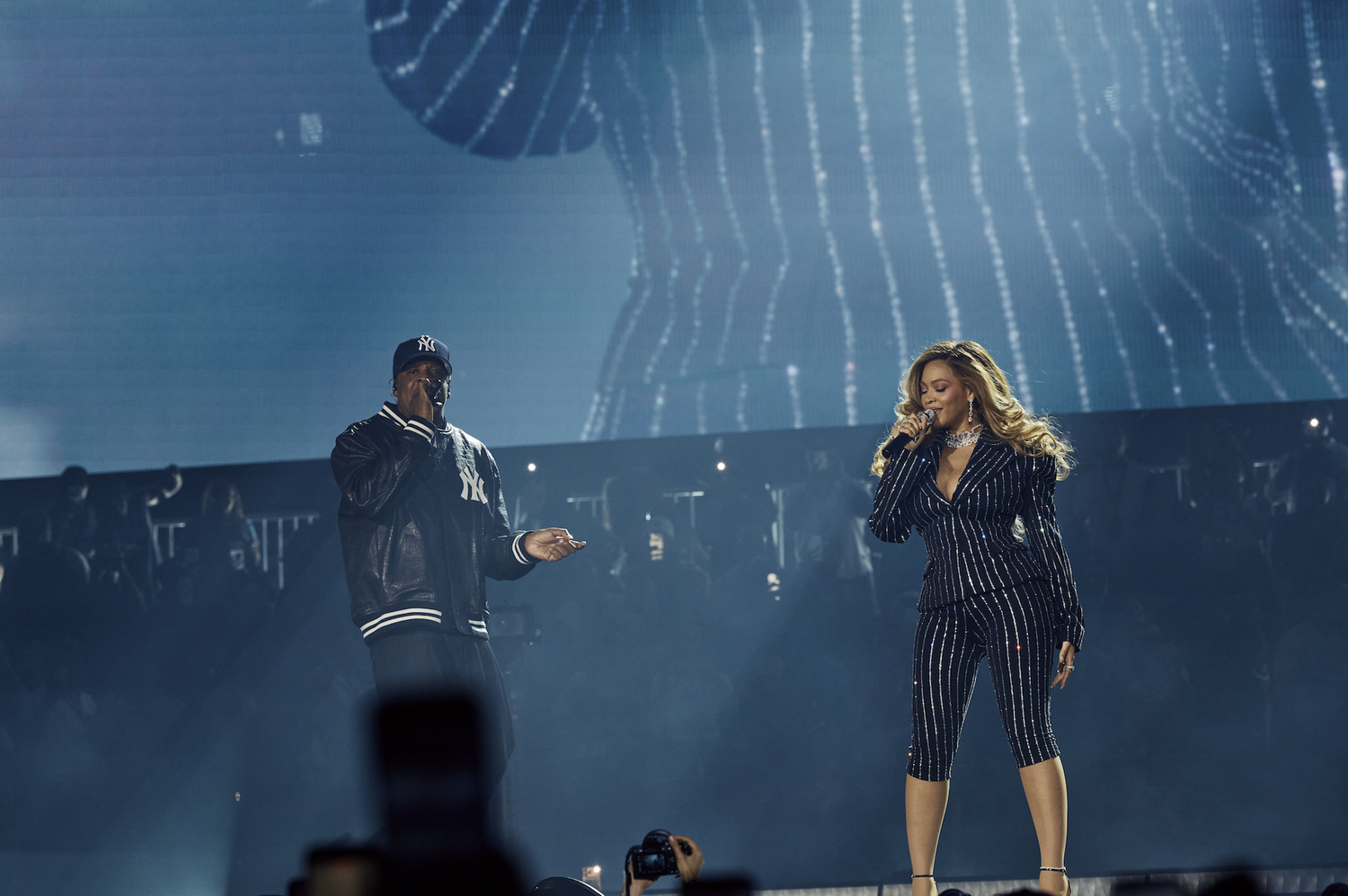 Beyoncé and JAŸ-Z performing on stage.