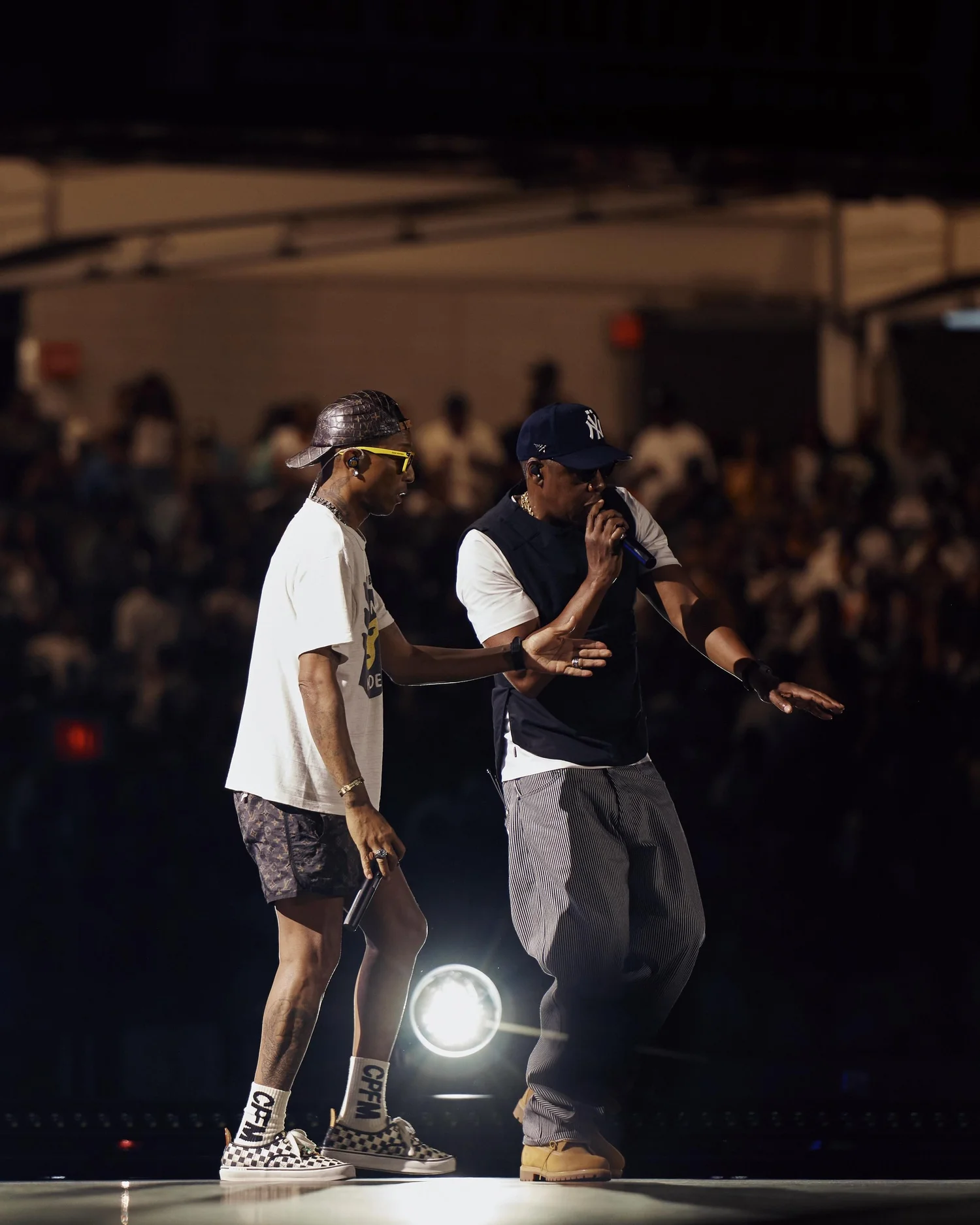 Pharrell and JAŸ Z performing on stage (Courtesy of Roc Nation)