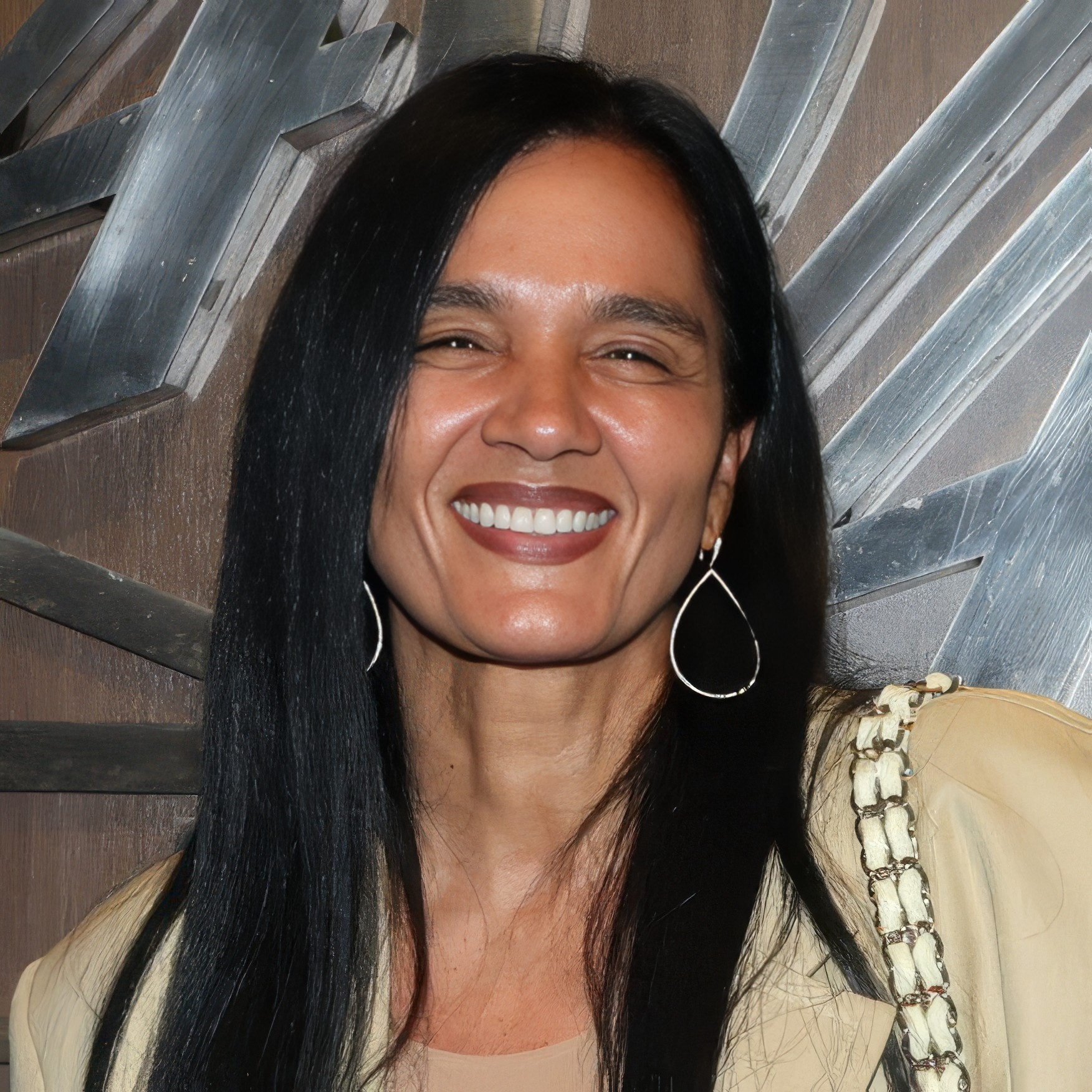 A picture of Desiree Perez smiling for a photo.